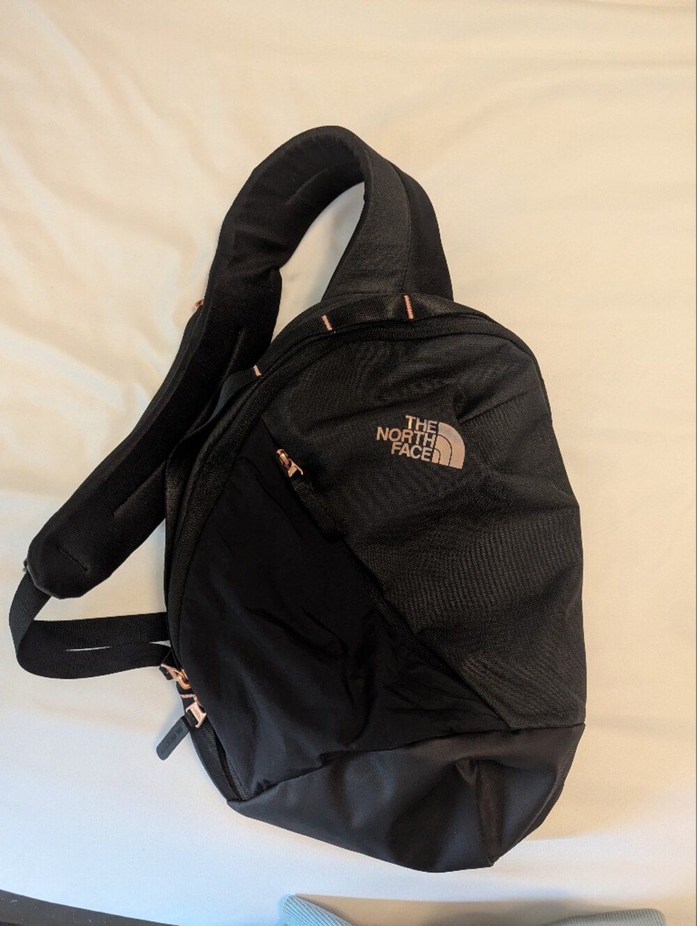 The North Face Black Sling Crossbody with Rose Gold Accents